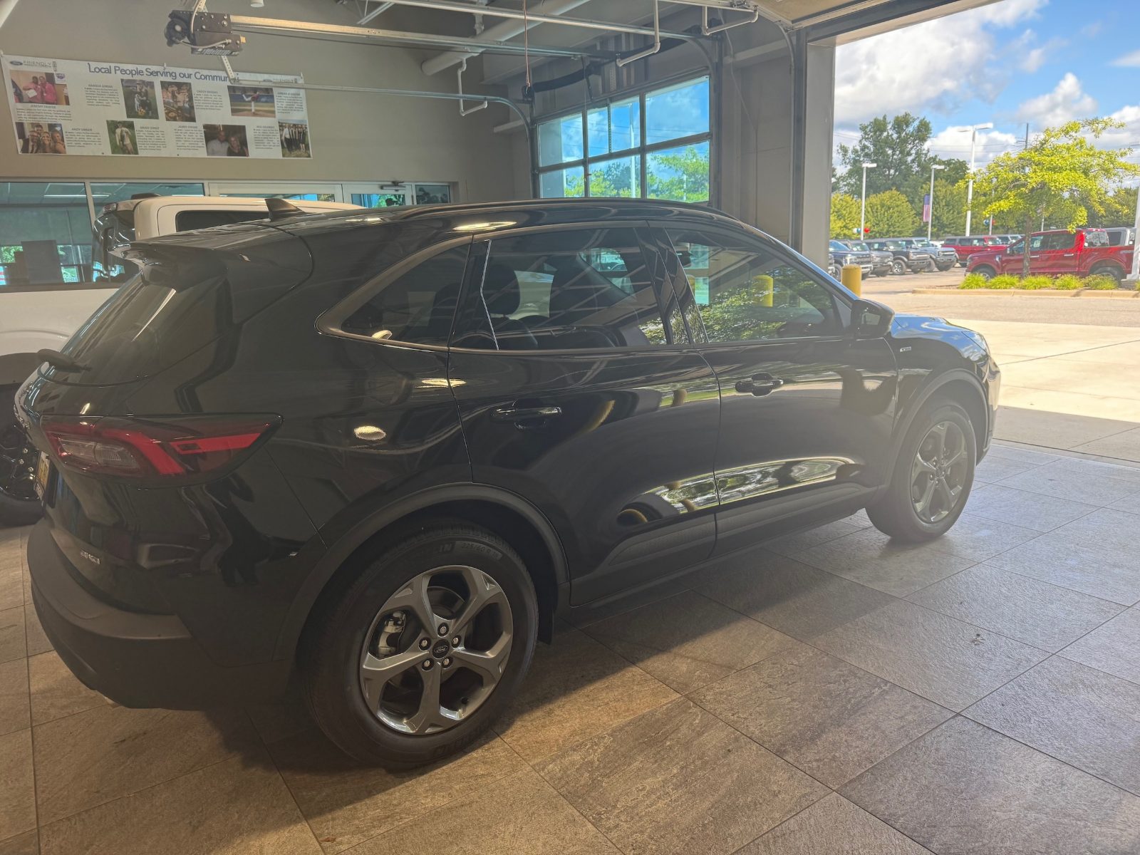 2025 Ford Escape ST-Line in black parked in the Friendly Ford delivery bay